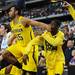 Michigan sophomore Jon Horford knocks freshman Caris LeVert in the face as they wait for a three-point shot to drop by senior Matt Vogrich during the last minute of play against Florida at Cowboys Stadium on Sunday, March 31, 2013. Melanie Maxwell I AnnArbor.com